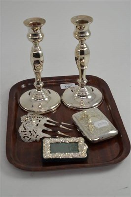 Lot 396 - A pair of silver loaded candlesticks, silver hair comb, silver cigarette case, small white...