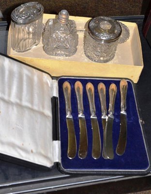 Lot 410 - A silver topped cut glass hair tidy, a silver topped toilet bottle, a scent bottle; a pair of...