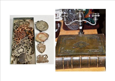 Lot 423 - Quantity of silver and gold plated chains, brooches, medal etc, a plated candlestick and...