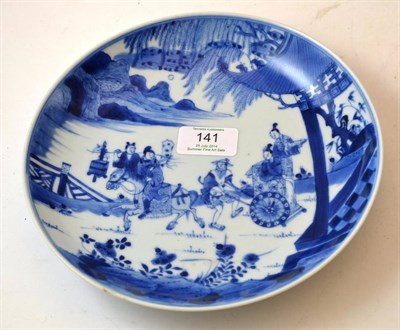 Lot 141 - A Chinese Porcelain Saucer Dish, 18th century, painted in underglaze blue with figures on horseback