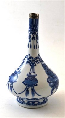Lot 142 - A Chinese Porcelain Bottle Vase, Kangxi, painted in underglaze blue with cabinets on tables and...