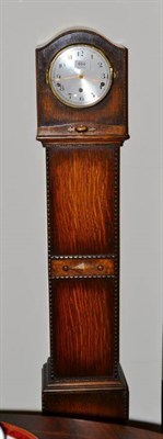 Lot 484 - A small chiming longcase clock