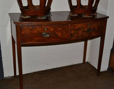 Lot 486 - A George III mahogany small bow front sideboard, fitted with two frieze drawers on square...