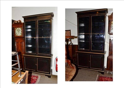 Lot 490 - A pair of modern black lacquered book cases with red speckle and parcel gilt decoration