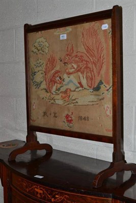 Lot 493 - A Victorian firescreen with needlework panel of two red squirrels, dated 1848