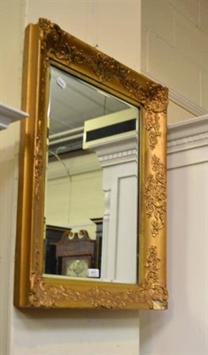 Lot 497 - A 19th century gilt and gesso rectangular wall mirror