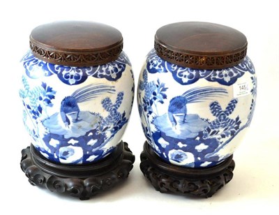 Lot 145 - A Pair of Chinese Porcelain Jars, painted in underglaze blue with peacocks amongst rockwork and...