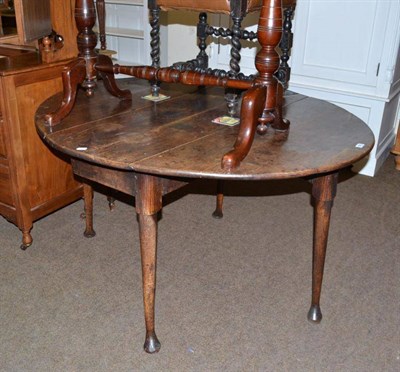 Lot 508 - A 19th century oak drop leaf dining table