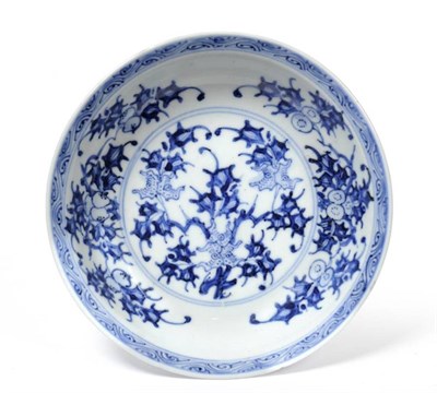 Lot 148 - A Chinese Porcelain Saucer Dish, Kangxi period, painted in underglaze blue with fruiting...