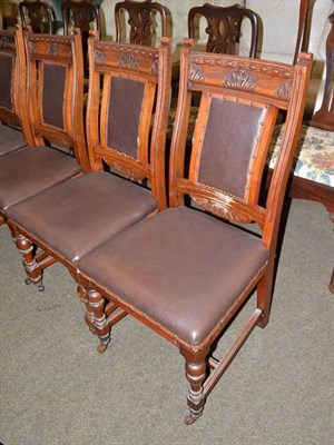 Lot 560 - A set of six Edwardian walnut dining chairs, a pair of dining chairs will pole cresting rails,...