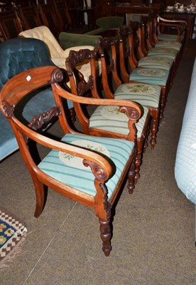 Lot 564 - A set of eight William IV mahogany dining chairs with carved top rails and drop in seat, raised...