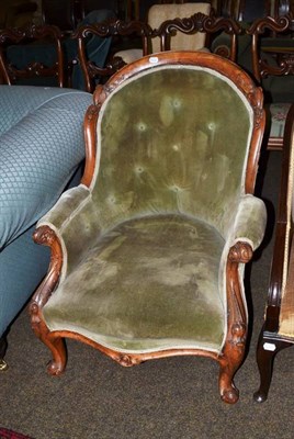 Lot 566 - A Victorian walnut frame armchair with green velvet upholstery (faded)