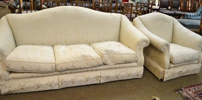 Lot 571 - One three seater sofa and an armchair