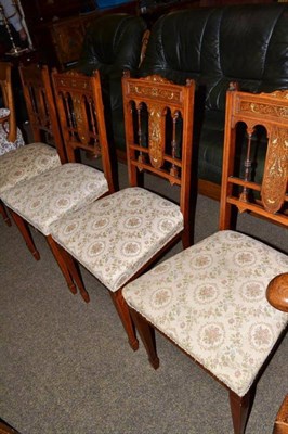 Lot 574 - A set of four Edwardian inlaid rosewood side chairs