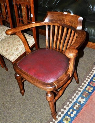 Lot 575 - An beech tub shaped captain's chair