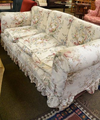 Lot 582 - A Victorian three seater settee with loose chintz cover