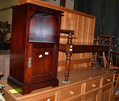 Lot 594 - An Edwardian mahogany window seat and a mahogany bedside cupboard