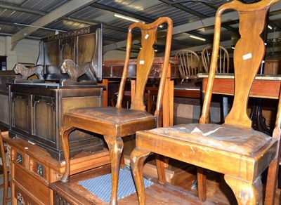 Lot 614 - An oak monk's bench, a pair of chairs and an oak occasional table