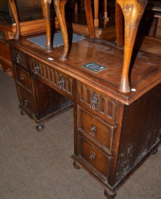 Lot 616 - A small oak knee hole desk