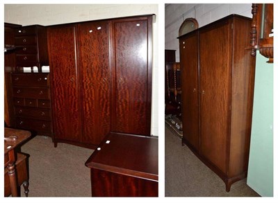 Lot 620 - A Stag Minstrell bedroom suite comprising of triple wardrobe, double wardrobe and pair of...