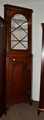 Lot 623 - A 19th century glazed oak floor standing corner cupboard