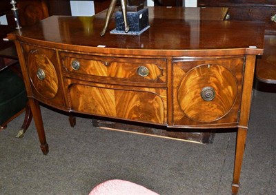 Lot 631 - A bow front sideboard