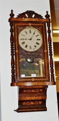 Lot 634 - A striking inlaid wall clock