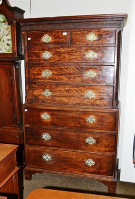 Lot 635 - A Georgian mahogany chest on chest with blind fret carved frieze and stiles