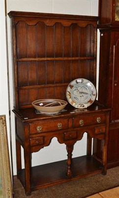 Lot 639 - A reproduction oak dresser and rack of small proportions