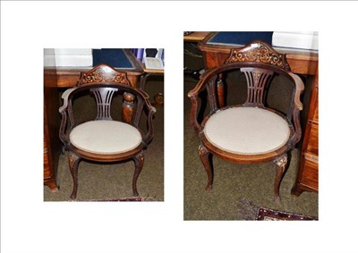 Lot 643 - A pair of Edwardian inlaid mahogany tub shape open arm chairs