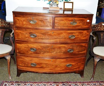 Lot 644 - A George III mahogany bowfront chest of two short and three long drawers