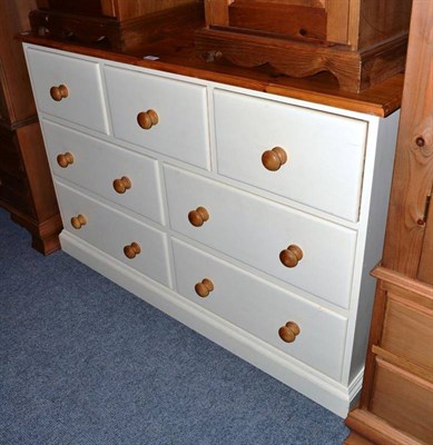 Lot 689 - A pine and cream painted chest of drawers