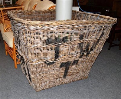 Lot 694 - A large wicker laundry basket