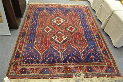 Lot 698 - Afshar rug South East Persia, the indigo field with a central claret medallion enclosed by...