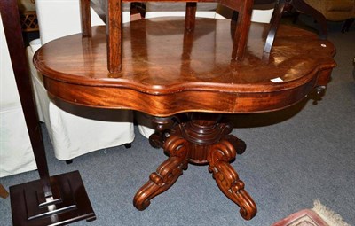 Lot 705 - A Victorian walnut centre table, the top of quatrefoil form