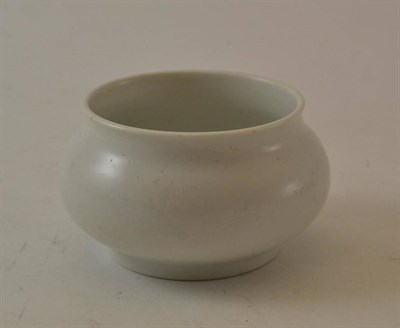 Lot 173 - A Chinese Blanc de Chine Small Pot, 17th/18th century, of cushioned circular form, carved with...
