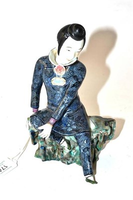 Lot 174 - A Chinese Porcelain Figure of a Scholar, late Qing Dynasty, wearing a high-collared shirt with...