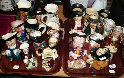 Lot 15 - A collection of twenty one Toby and character jugs on two trays