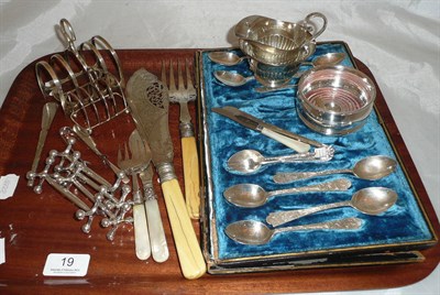 Lot 19 - Two silver toast racks, silver tongs, silver butter knife, part-cased set of silver teaspoons,...