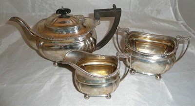 Lot 23 - A silver three piece tea set, by Thomas Edward Atkins, Birmingham 1914 and 1916