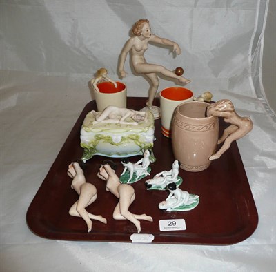 Lot 29 - A collection of erotic ceramics including bisque reclining ladies, mugs, etc