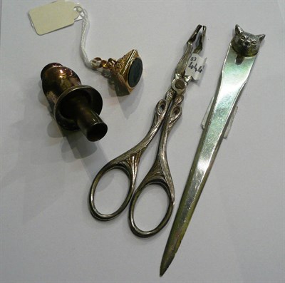 Lot 62 - A 9ct gold intaglio seal fob, a silver fox mask decorated paper knife, a wine pourer and a pair...