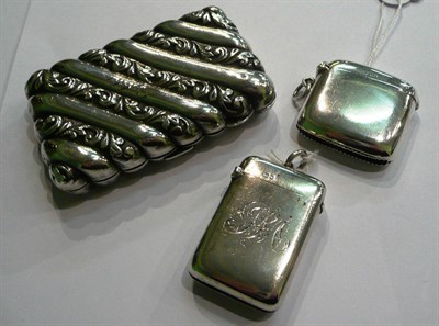 Lot 88 - Two silver vestas and a silver cigarette case