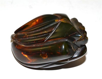 Lot 187 - A Chinese Carved Amber Model of a Stylised Peach, with leaves, 8.5cm long