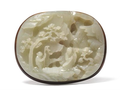 Lot 192 - A Chinese Celadon Jade Plaque, Qing Dynasty, of oval form, carved in high relief with a sage...