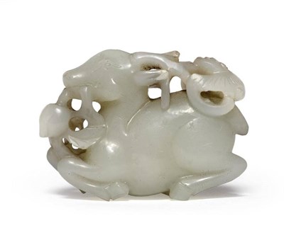 Lot 194 - A Chinese Jade Figure of a Deer, recumbent eating a fruiting branch, 5.5cm long