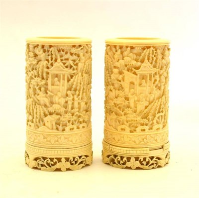 Lot 215 - A Pair of Cantonese Ivory Spill Vases, mid 19th century, of cylindrical form, carved with a...