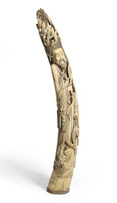Lot 216 - A Large and Impressive Chinese Ivory Figure of a Fisherman, early 20th century, the standing figure