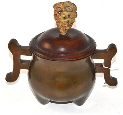 Lot 222 - A Chinese Bronze Censer and Hardwood Cover, in Archaic style, the turned cover with jade knop...
