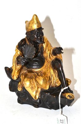 Lot 231 - A Chinese Parcel Gilt Bronze Figure of a Scholar, Qing Dynasty, seated wearing flowing robes, a...